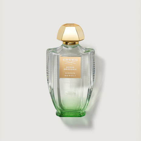 Green Neroli 100ml Bottle with gold cap and clear bottle with tainted green glass at bottom