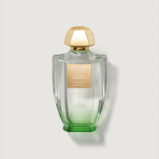 Green Neroli 100ml Bottle with gold cap and clear bottle with tainted green glass at bottom